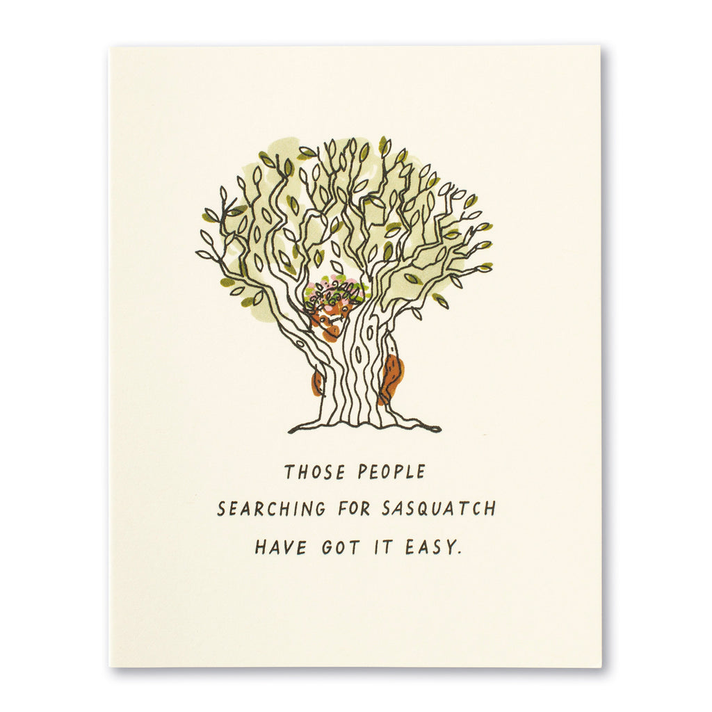 Friendship Greeting Card - Those People Searching for Sasquatch Have Got It Easy. Illustration shows a sasquatch hiding behind a tree with type at the bottom.