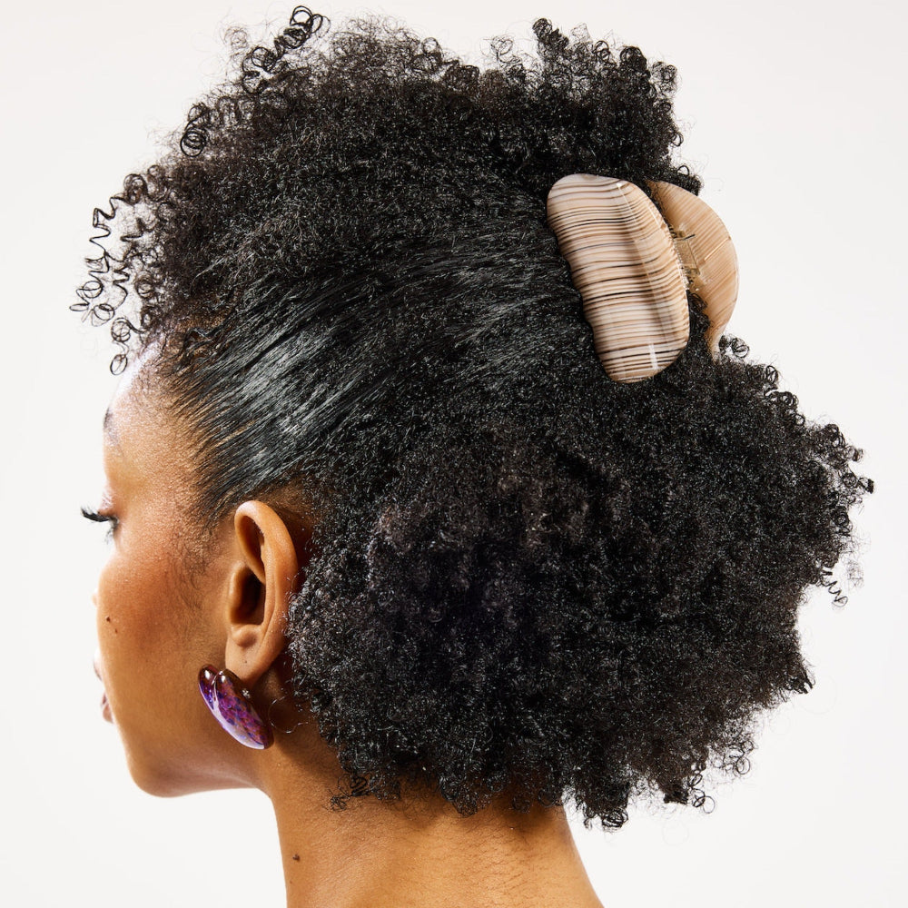 Woman with half up half down hairstyle wearing the Chunks Juno Hair Claw Clip in Oak