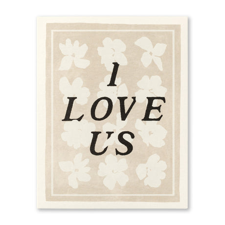 Anniversary Greeting Card - I Love Us! Illustration shows typography over a cream and white floral background with border.