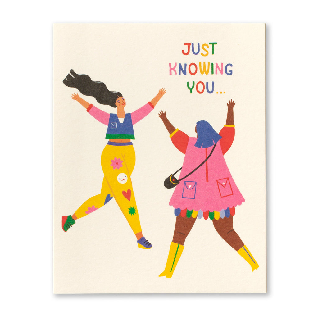 Friendship Greeting Card - Just Knowing You... Illustration shows two women dressed in very colorful clothing running towards each other with their arms out to hug.