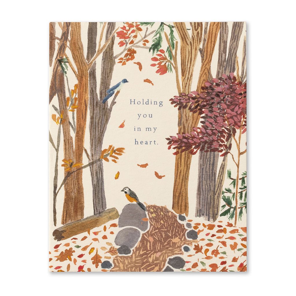 Sympathy Greeting Card - Holding You in my Heart. Illustration shows a pathway through a forest during autumn with a robin bird on a rock.