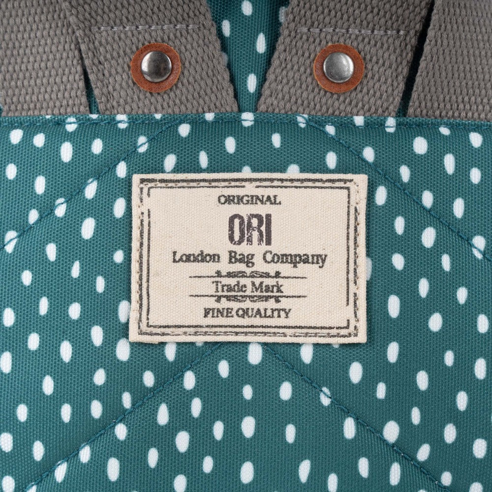 Bantry B Small Sustainable Recycled Canvas Backpack Drizzle Sage Original Ori London Bag Company Trademark Label Close Up
