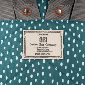 Bantry B Small Sustainable Recycled Canvas Backpack Drizzle Sage Original Ori London Bag Company Trademark Label Close Up