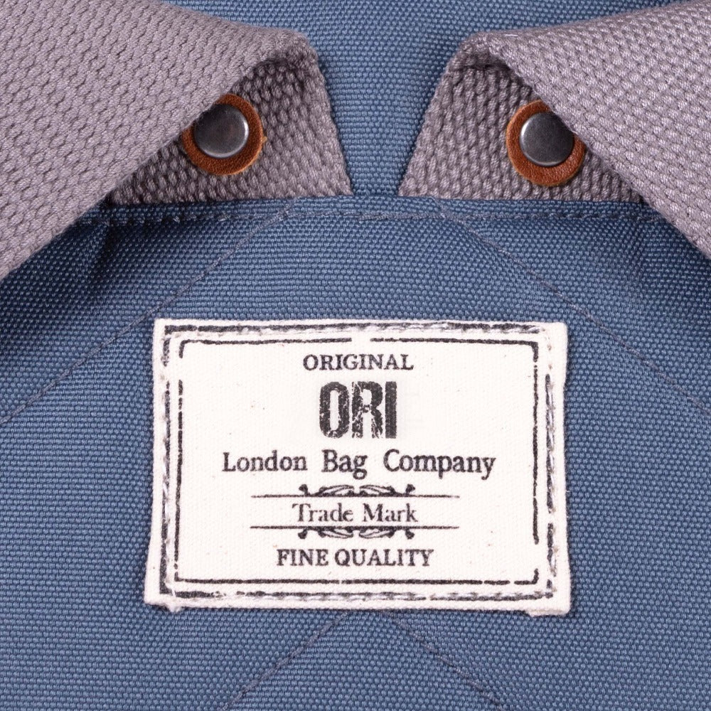 Bantry B Small Sustainable Recycled Canvas Backpack Airforce Original Ori London Bag Company Trademark Label Close Up