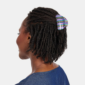 Woman with a half up half down hairstyle wearing the Chunks Juno Hair Claw Clip in the striped Frances colorway