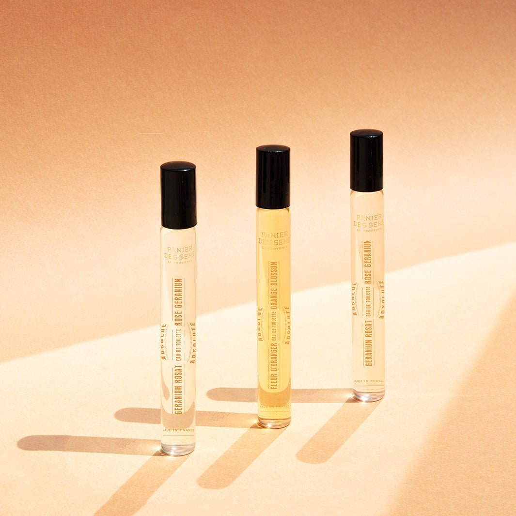 Three roll-on perfume bottles in a row