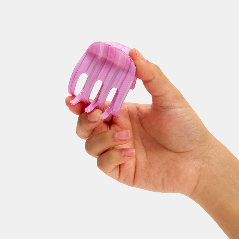 Hand holding Chunks Hair Claw Clip in Petunia Multicolor Striped Pink