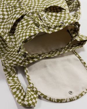 Baggu Moss Trippy Checker Drawstring Backpack is shown open with a loose drawstring and a peak inside the bag.