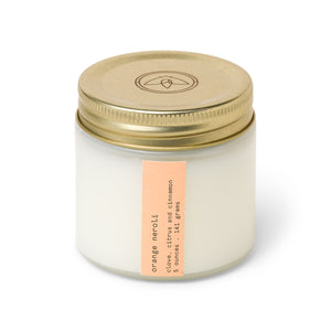 Firefly Senses 5oz. White Glass With Gold Metal Lid with Orange Label. Orange Neroli.